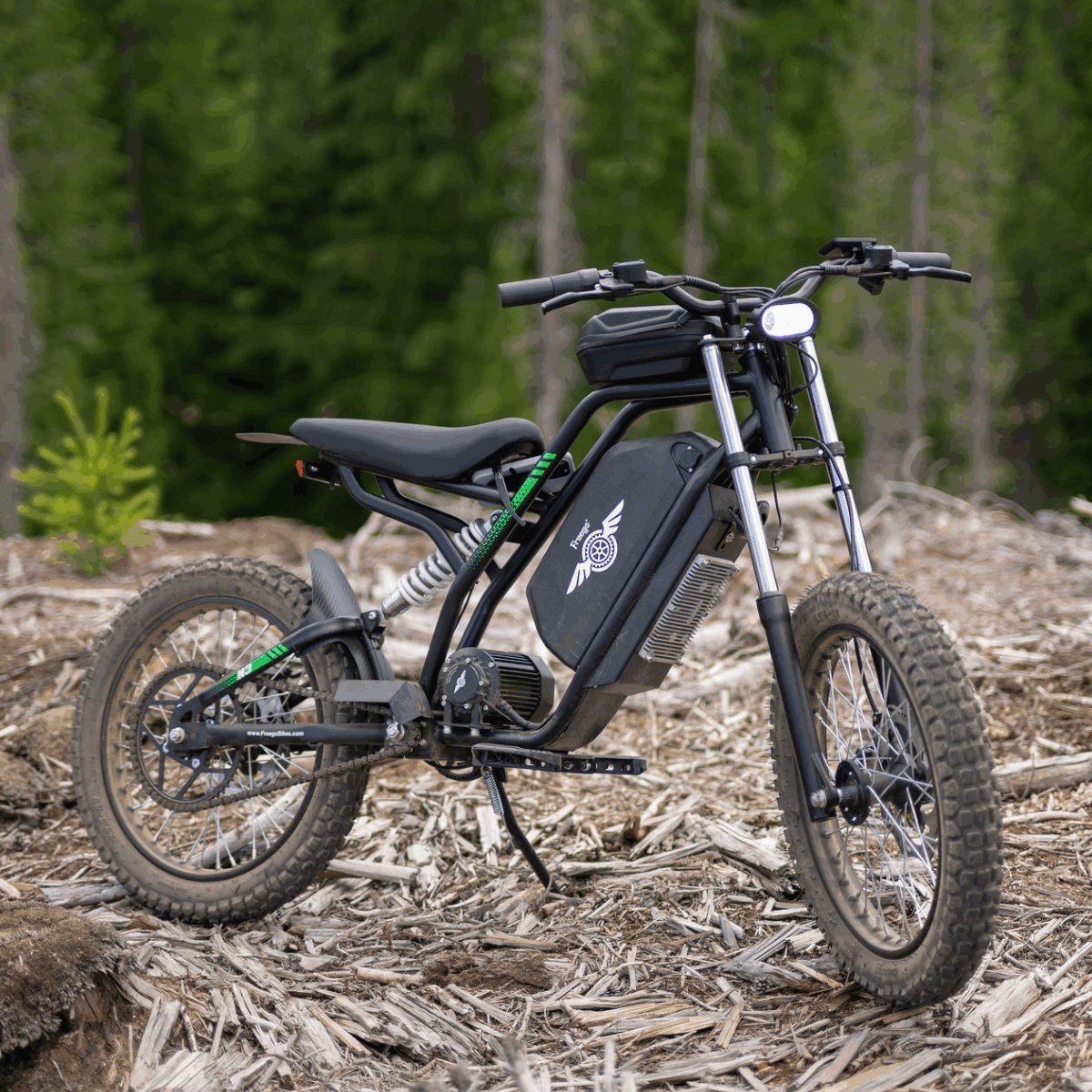 Freego Nova 3 off-road electric bike on a forest floor with trees in the background